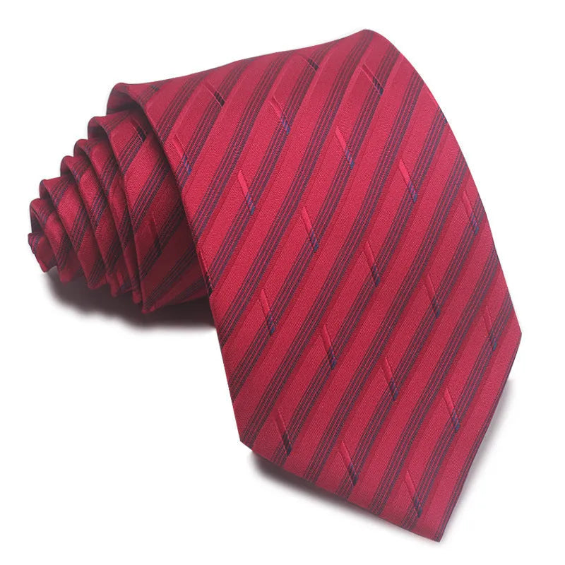 Close-up of a red and black striped jacquard weave tie with an arrow tip, showing texture.