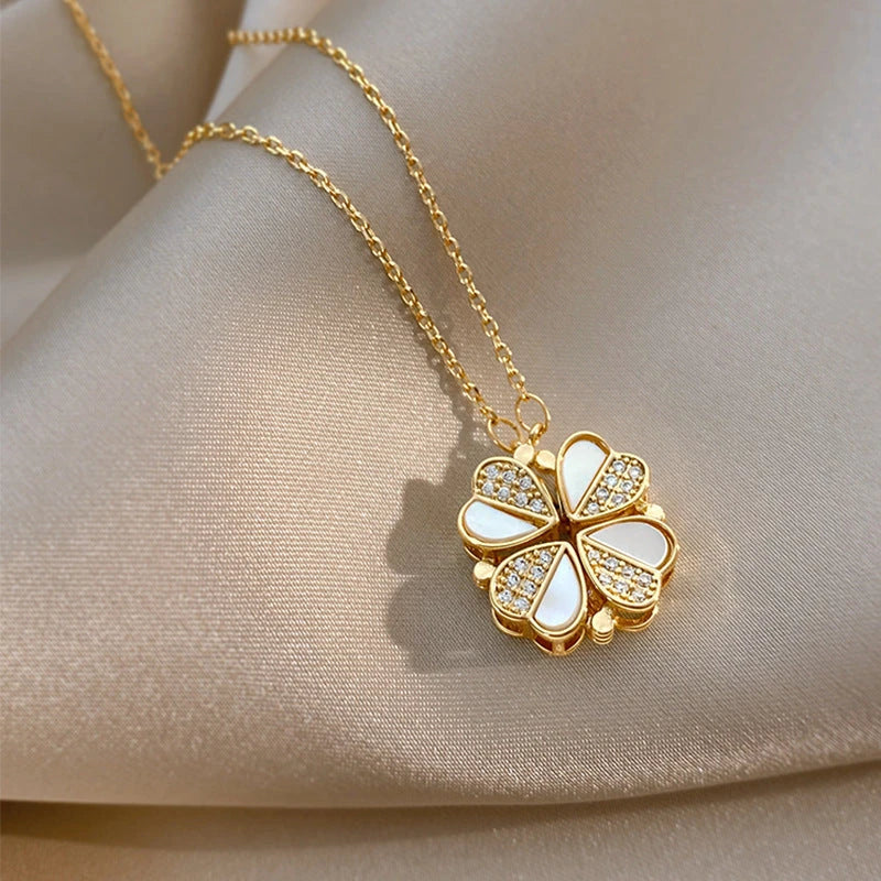 Elegant four-leaf clover pendant necklace with sparkling crystal heart detail, made of premium stainless steel for women's fashion jewelry gift