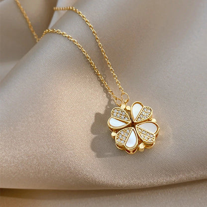 Elegant four-leaf clover pendant necklace with sparkling crystal heart detail, made of premium stainless steel for women's fashion jewelry gift