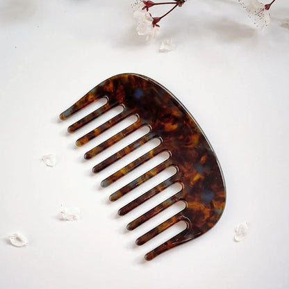 Retro acetate hair comb in cherry blossom powder colour showing 10x6.2cm dimensions and rounded teeth