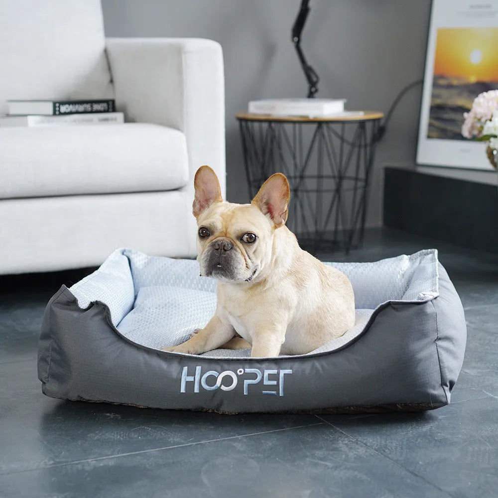 Soft grey dog bed with removable cover showing sizes for small, medium, and large pets