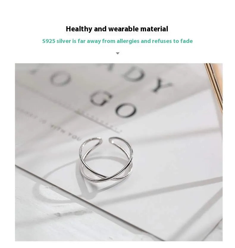 Adjustable silver plated geometric cross ring for women in gold tone or silver tone on a copper base.