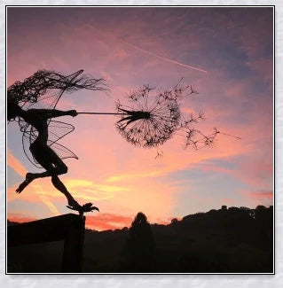 Metal fairy garden decoration with magical dandelions dancing in the wind, enchanting outdoor decor