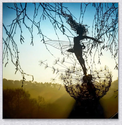 Metal fairy garden decoration with magical dandelions dancing in the wind, enchanting outdoor decor