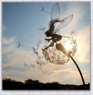 Metal fairy garden decoration with magical dandelions dancing in the wind, enchanting outdoor decor