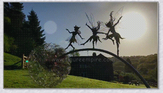 Metal fairy garden decoration with magical dandelions dancing in the wind, enchanting outdoor decor