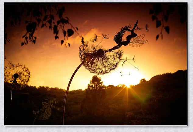 Metal fairy garden decoration with magical dandelions dancing in the wind, enchanting outdoor decor