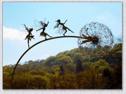 Metal fairy garden decoration with magical dandelions dancing in the wind, enchanting outdoor decor