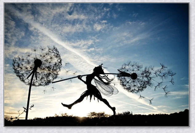 Metal fairy garden decoration with magical dandelions dancing in the wind, enchanting outdoor decor