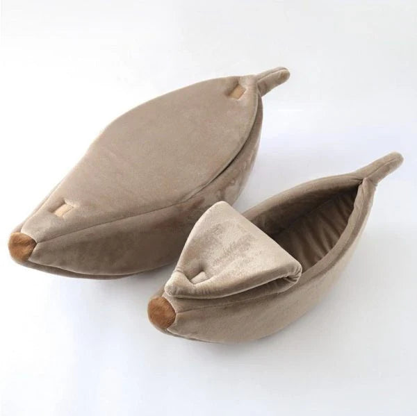 Comfortable banana-shaped pet sleeping bag made with soft, plush materials for cozy pet napping