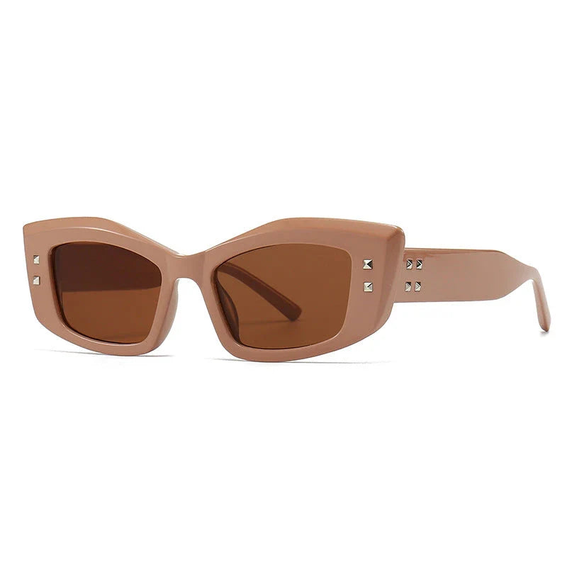 Retro cat eye sunglasses with rivet details in a bold, square frame for a fashionable and unique look