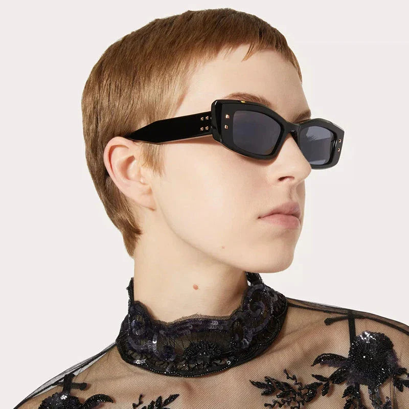 Retro cat eye sunglasses with rivet details in a bold, square frame for a fashionable and unique look