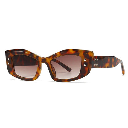 Retro cat eye sunglasses with rivet details in a bold, square frame for a fashionable and unique look