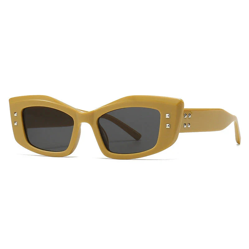 Retro cat eye sunglasses with rivet details in a bold, square frame for a fashionable and unique look