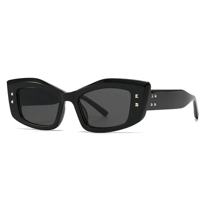 Retro cat eye sunglasses with rivet details in a bold, square frame for a fashionable and unique look