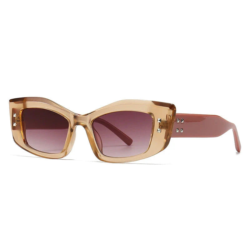 Retro cat eye sunglasses with rivet details in a bold, square frame for a fashionable and unique look
