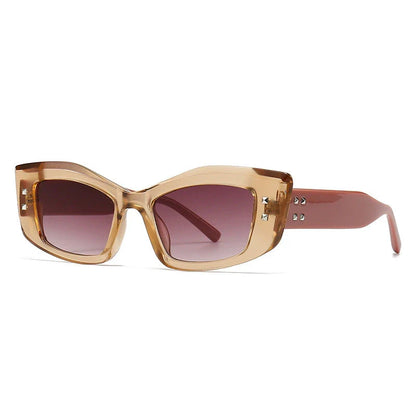 Retro cat eye sunglasses with rivet details in a bold, square frame for a fashionable and unique look