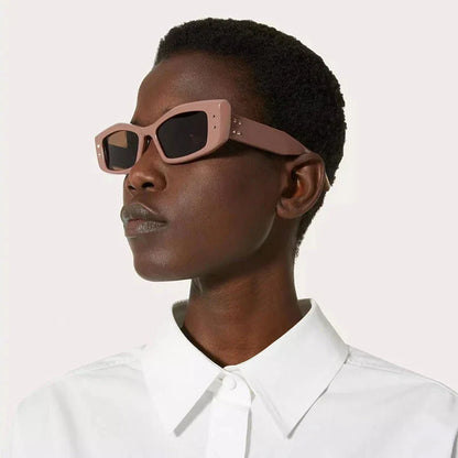 Retro cat eye sunglasses with rivet details in a bold, square frame for a fashionable and unique look