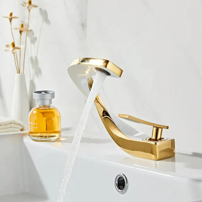 Elegant brass gold and white bathroom faucet with contemporary design and single handle control