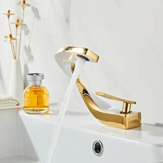 Elegant brass gold and white bathroom faucet with contemporary design and single handle control