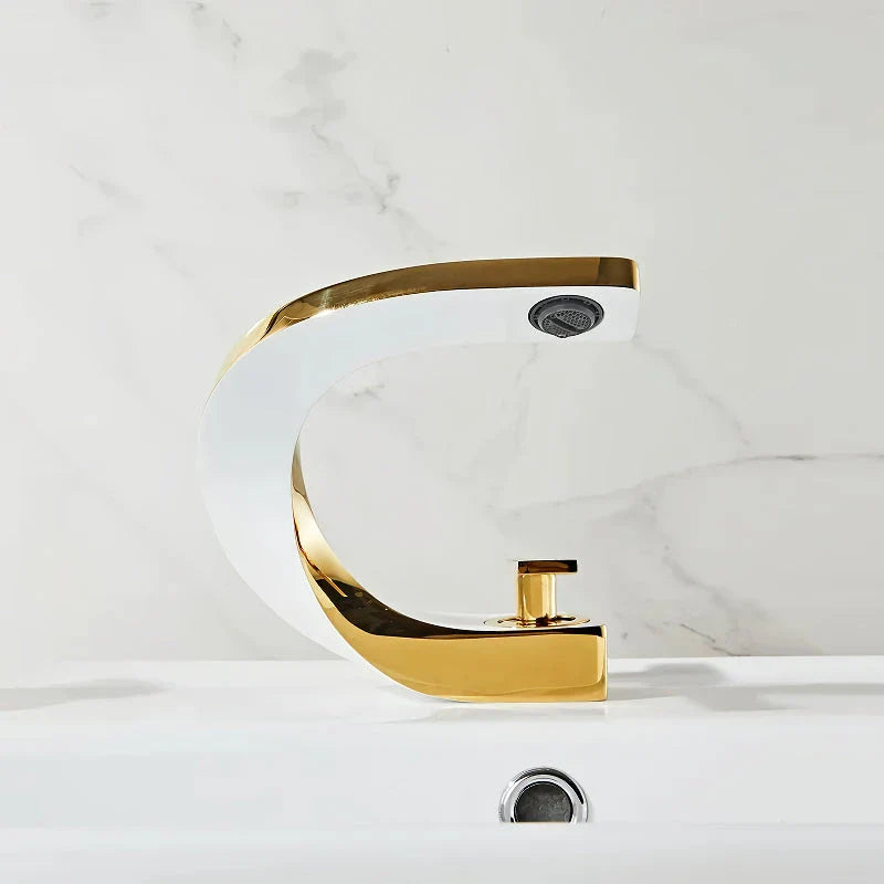 Elegant brass gold and white bathroom faucet with contemporary design and single handle control