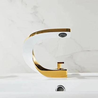 Elegant brass gold and white bathroom faucet with contemporary design and single handle control