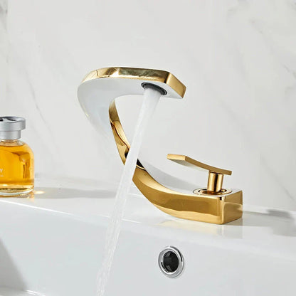Elegant brass gold and white bathroom faucet with contemporary design and single handle control