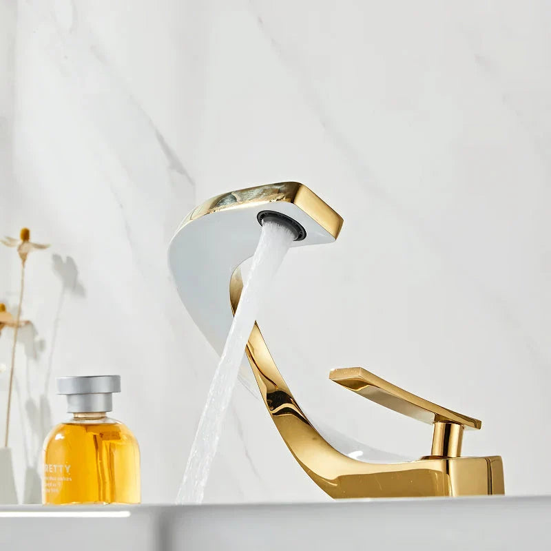 Elegant brass gold and white bathroom faucet with contemporary design and single handle control
