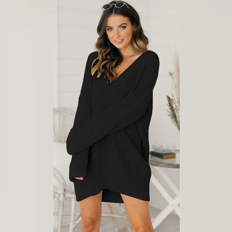 Loose v-neck knitted dress in a relaxed, comfortable silhouette with a v-neckline and long sleeves