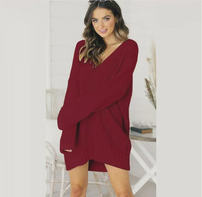 Loose v-neck knitted dress in a relaxed, comfortable silhouette with a v-neckline and long sleeves