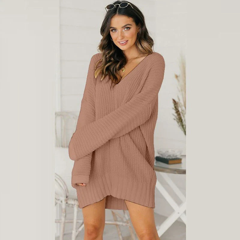 Loose v-neck knitted dress in a relaxed, comfortable silhouette with a v-neckline and long sleeves