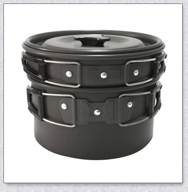 A complete camping cookware set including a teapot, cooking pot, and frying pan for convenient outdoor cooking and meal preparation
