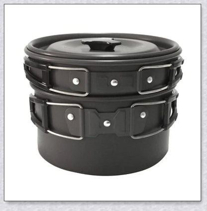 A complete camping cookware set including a teapot, cooking pot, and frying pan for convenient outdoor cooking and meal preparation