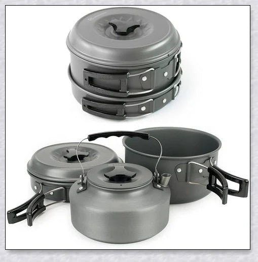 A complete camping cookware set including a teapot, cooking pot, and frying pan for convenient outdoor cooking and meal preparation