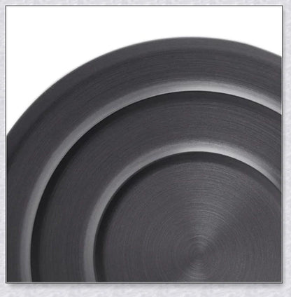 A complete camping cookware set including a teapot, cooking pot, and frying pan for convenient outdoor cooking and meal preparation