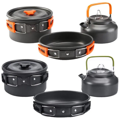 A complete camping cookware set including a teapot, cooking pot, and frying pan for convenient outdoor cooking and meal preparation
