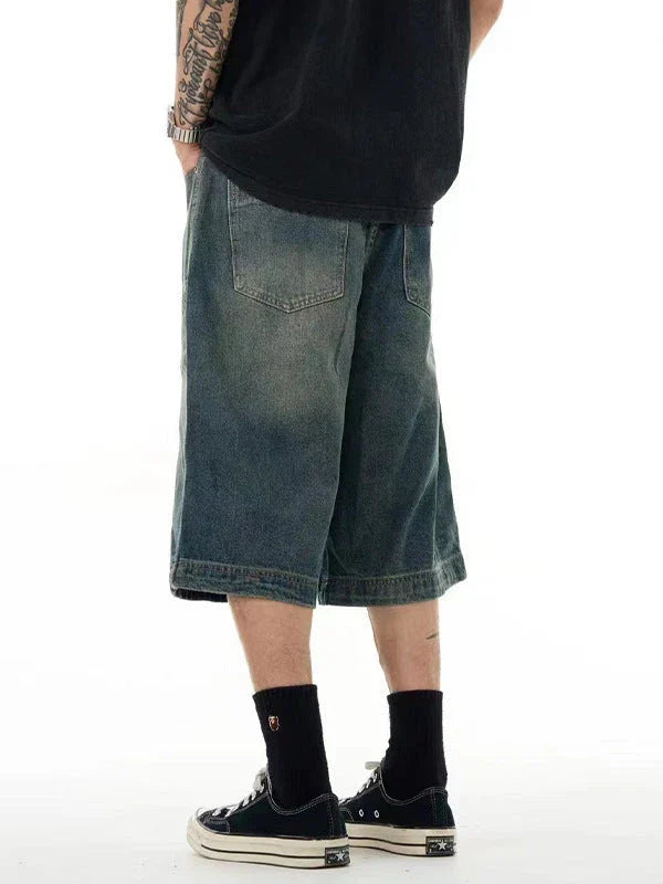 Men's casual denim shorts with a relaxed, wide-leg design and washed finish