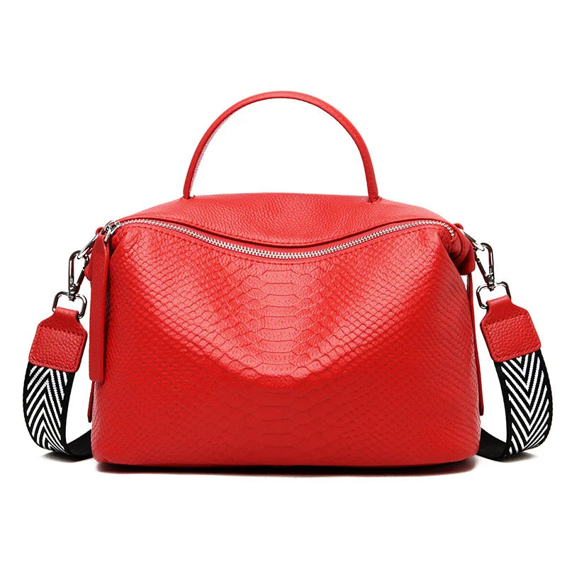 A stylish and durable messenger bag made from first-layer cowhide leather, with an adjustable shoulder strap and multiple interior pockets for organization.