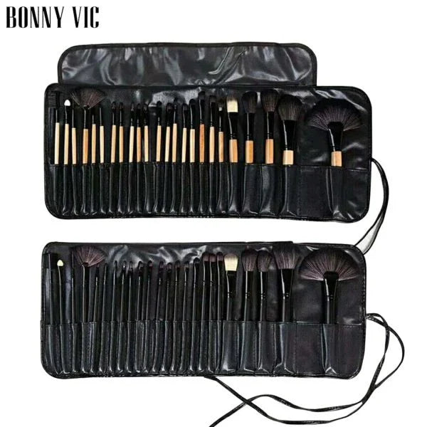 24 luxurious makeup brushes with wood-toned or black handles, presented in a stylish carrying case for on-the-go beauty touch-ups