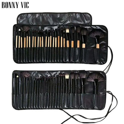 24 luxurious makeup brushes with wood-toned or black handles, presented in a stylish carrying case for on-the-go beauty touch-ups