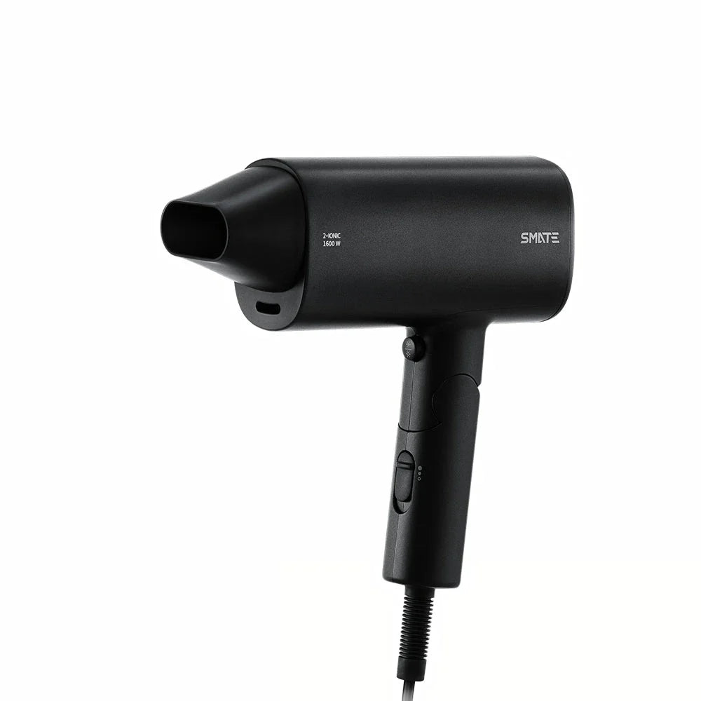 Compact, portable hair dryer with foldable handle and multiple styling settings for on-the-go hair care.