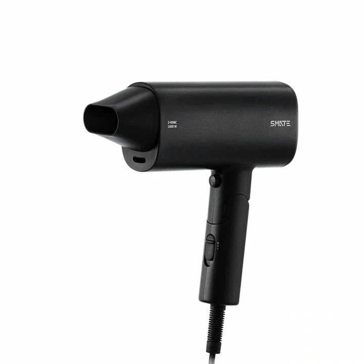 Compact, portable hair dryer with foldable handle and multiple styling settings for on-the-go hair care.