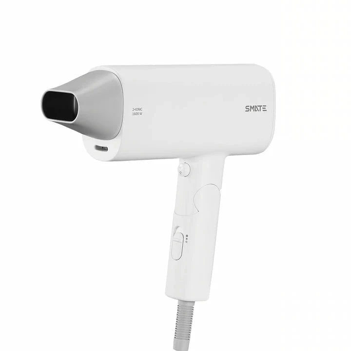 Compact, portable hair dryer with foldable handle and multiple styling settings for on-the-go hair care.