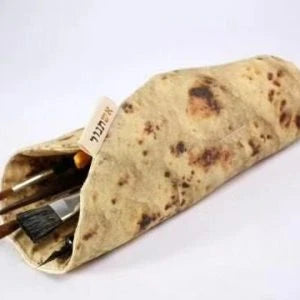 A unique, burrito-shaped pencil case made from high-quality fabric with a soft, comfortable grip