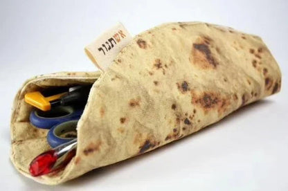 A unique, burrito-shaped pencil case made from high-quality fabric with a soft, comfortable grip