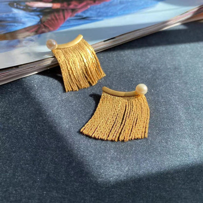 Metal tassel chain earrings with freshwater pearls, a versatile accessory for any outfit