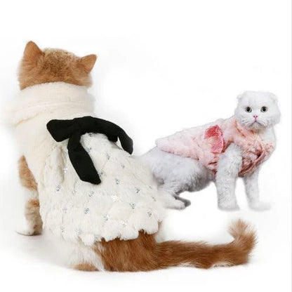 Elegant winter coat for cats, made with soft cotton and plush faux fur to keep your feline friend warm and cozy during the colder months