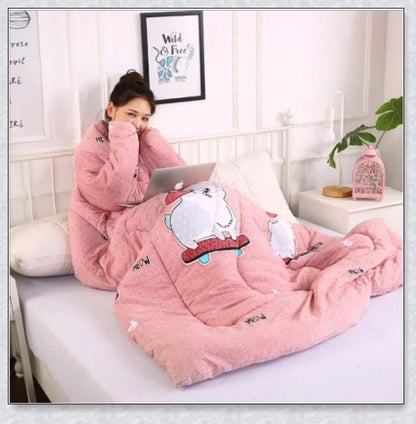 A cozy, wearable lazy quilt with sleeves in gray, providing hands-free warmth and comfort for relaxation and outdoor activities.