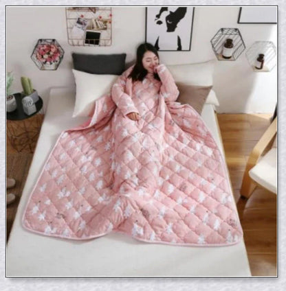 A cozy, wearable lazy quilt with sleeves in gray, providing hands-free warmth and comfort for relaxation and outdoor activities.