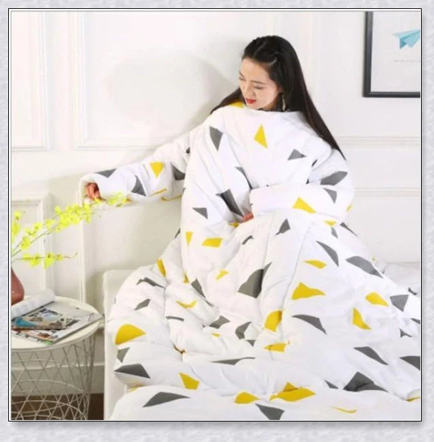 A cozy, wearable lazy quilt with sleeves in gray, providing hands-free warmth and comfort for relaxation and outdoor activities.